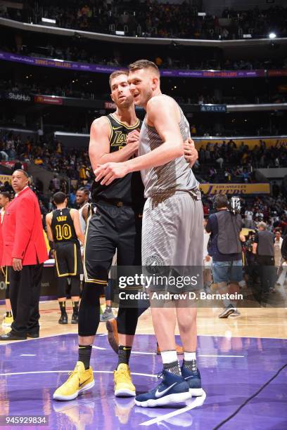 Cole Aldrich of the Minnesota Timberwolves and Travis Wear of the Los Angeles Lakers hug after the game between the two teams on April 6, 2018 at...