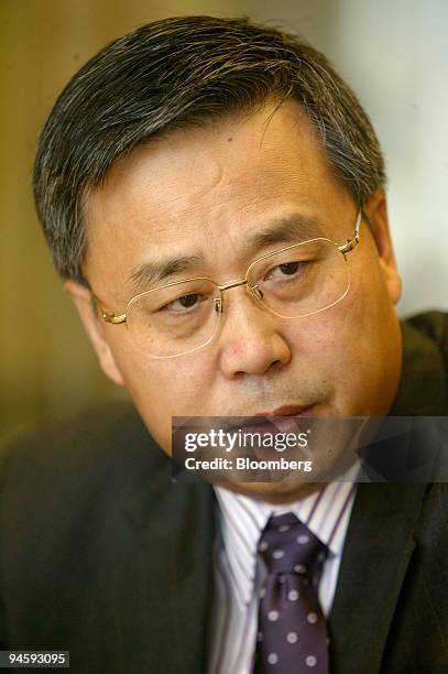 Guo Shuqing, chairman of China Construction Bank, pauses during an interview in Bloomberg's offices in Beijing, China, on Monday, September 11, 2006....