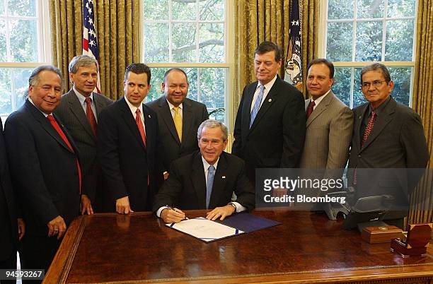 President George W. Bush signs the Native American Home Ownership Opportunity Act of 2007 in the Oval Office at the White House, Monday, June 18 in...