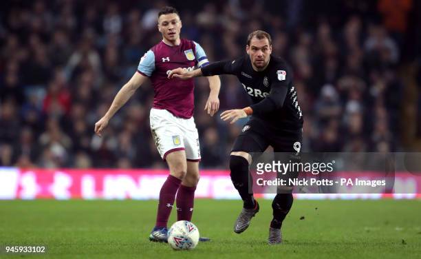 Aston Villa's James Chester and Leeds United's Pierre-Michel Lasogga battle for the ball during the Sky Bet Championship match at Villa Park,...