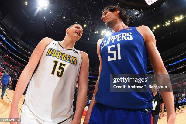 Nikola Jokic of the Denver Nuggets speaks to Boban Marjanovic of the LA Clippers after the game between the two teams on April 7, 2018 at STAPLES...