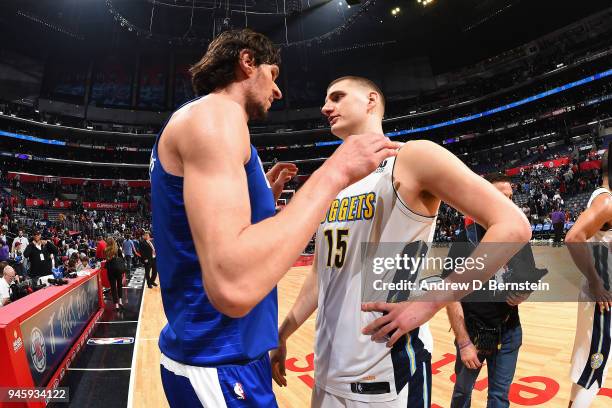 Nikola Jokic of the Denver Nuggets speaks to Boban Marjanovic of the LA Clippers after the game between the two teams on April 7, 2018 at STAPLES...