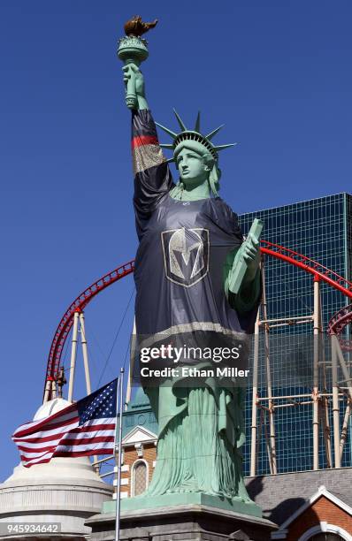 New York-New York Hotel & Casino's half-size replica of Lady Liberty wears a 600-pound vinyl Vegas Golden Knights jersey ahead of Game Two of the...