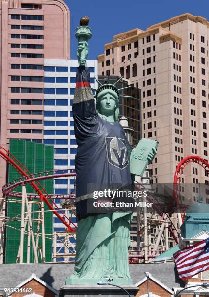 New York-New York Hotel & Casino's half-size replica of Lady Liberty wears a 600-pound vinyl Vegas Golden Knights jersey ahead of Game Two of the...