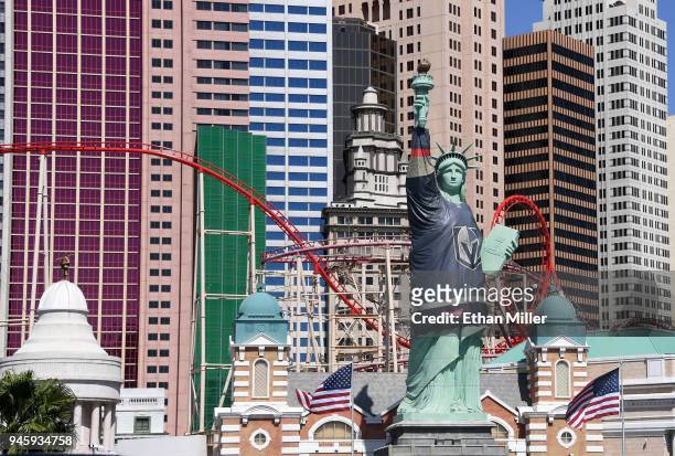 New York-New York Hotel & Casino's half-size replica of Lady Liberty wears a 600-pound vinyl Vegas Golden Knights jersey ahead of Game Two of the...
