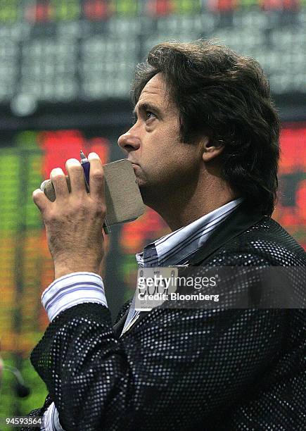 Trader Bryan Cooley contemplates a trade as he works in the S&P 500 pit at the Chicago Mercantile Exchange in Chicago, Illinois, Friday, Oct. 15,...