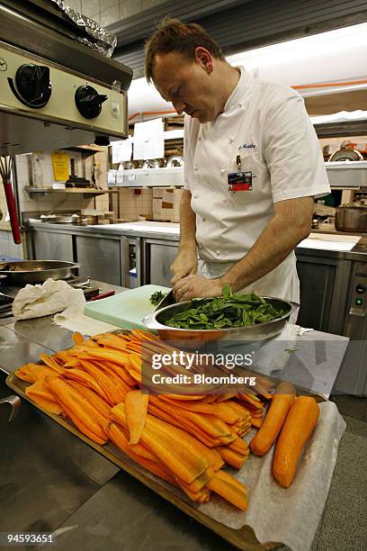 Olivier Matthey prepares vegetables in the kitchen of the Belvedere Hotel, one of the main hotels housing attendees of the World Economic Forum in...