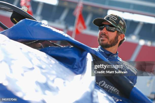 Martin Truex Jr., driver of the Auto-Owners Insurance Toyota, gets into his car during qualifying for the Monster Energy NASCAR Cup Series Food City...