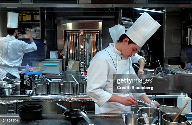 Chefs work in the kitchen at the Jules Verne restaurant, on the second floor of the Eiffel Tower, in Paris, France on Thursday, Jan. 17, 2008. There...