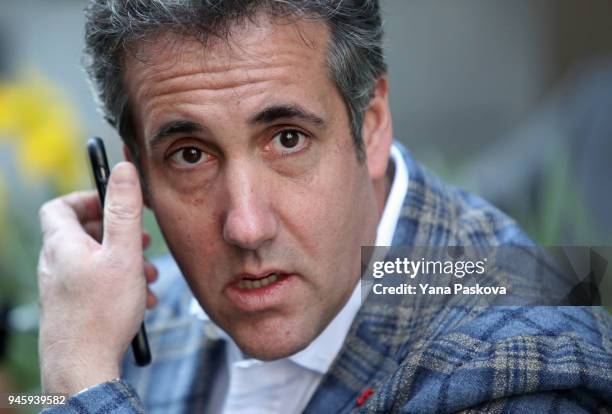 Michael Cohen, U.S. President Donald Trump's personal attorney, takes a call near the Loews Regency hotel on Park Ave on April 13, 2018 in New York...