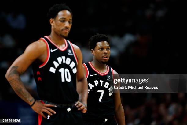 Kyle Lowry and DeMar DeRozan of the Toronto Raptors look on against the Miami Heat during the first half at American Airlines Arena on April 11, 2018...