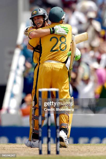 Australian batsman Adam Gilchrist, left, hugs teammate Matthew Hayden after the Gilchrist scored a century against Sri Lanka during the 2007 ICC...