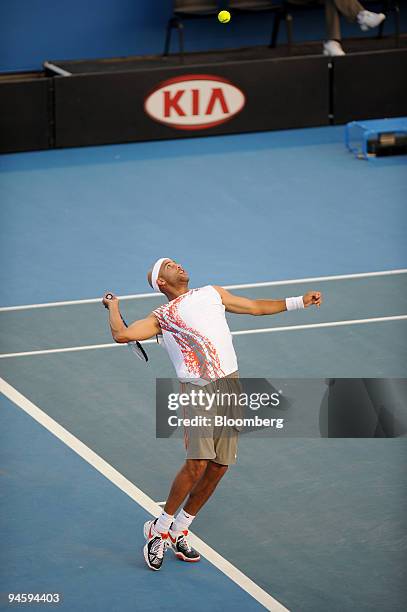 James Blake of the United States serves to Michael Russell of the United States in a second round match on day four of the Australian Open tennis...