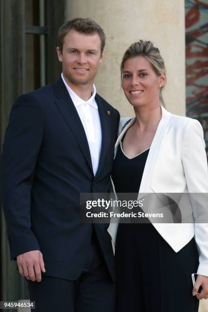 Alexis Pinturault skier silver medalist at the Pyeongchang Winter Olympics and his wife pose at the Elysee Palace after a cocktail hosted given by...