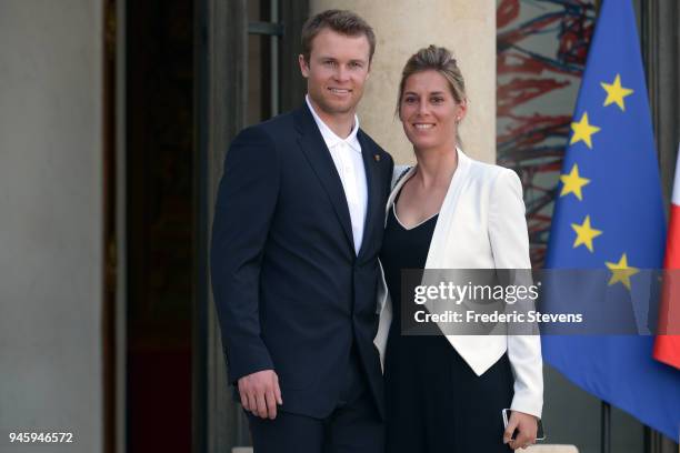 Alexis Pinturault skier silver medalist at the Pyeongchang Winter Olympics and his wife pose at the Elysee Palace after a cocktail hosted given by...