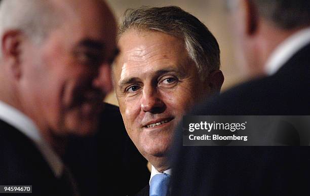 Malcolm Bligh Turnbull, Australia's minister of water and the environment, center, speaks with guests prior to Australian Prime Minister John...