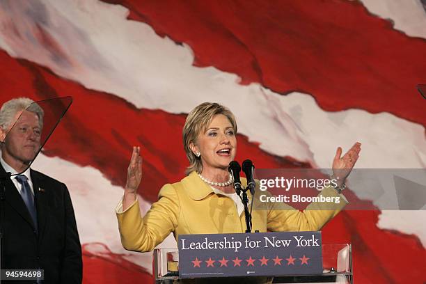 Former U.S. President Bill Clinton, left, and his wife Senator Hillary Rodham Clinton celebrate Senator Clinton's re-election victory on Tuesday,...