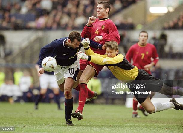 Geert De Vlieger of Belgium punches the ball away from Don Hutchison of Scotland during the World Cup 2002 Group Six Qualifying match played at...