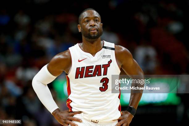 Dwyane Wade of the Miami Heat looks on against the Toronto Raptors during the first half at American Airlines Arena on April 11, 2018 in Miami,...