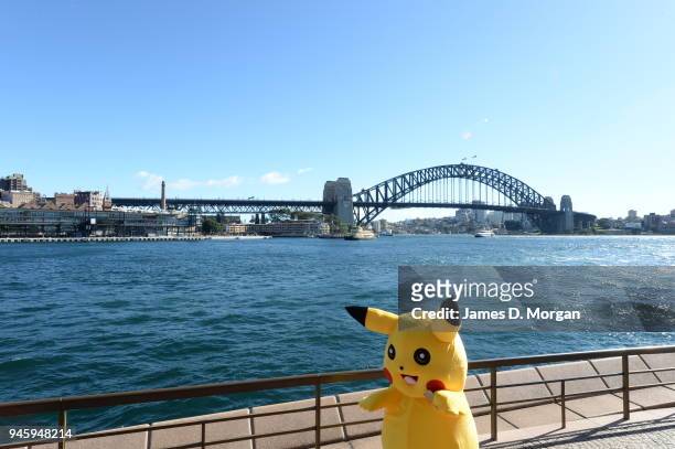 Pikachu doing some promotional meeting and greeting for a mobile phone company near to the Opera House and Harbour Bridge on July 23, 2016 in Sydney,...