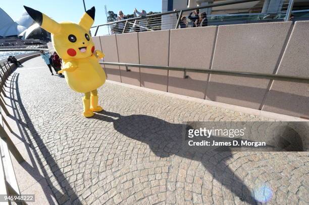 Pikachu doing some promotional meeting and greeting for a mobile phone company near to the Opera House and Harbour Bridge on July 23, 2016 in Sydney,...