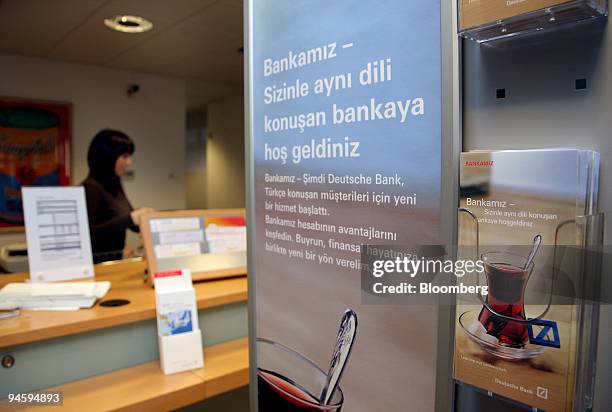An advertisement for services written in Turkish hangs on the wall of a Deutsche Bank branch in Frankfurt-Hoechst, Germany, on Wednesday, Jan. 16,...