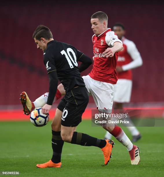 Charlie Gilmour of Arsenal challenges Adnan Maric of Swansea during the match between Arsenal U23 and Swansea U23 at Emirates Stadium on April 13,...