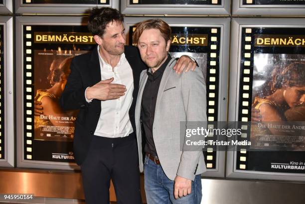 Oliver Mommsen and producer Adrian Topol during the premiere 'Die Haut der Anderen' at Kino in der Kulturbrauerei on April 13, 2018 in Berlin,...