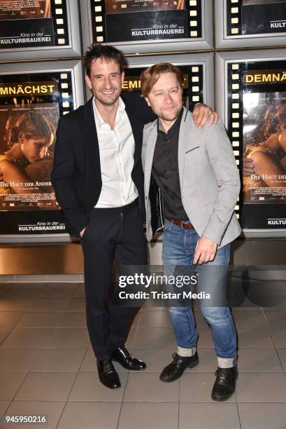 Oliver Mommsen and producer Adrian Topol during the premiere 'Die Haut der Anderen' at Kino in der Kulturbrauerei on April 13, 2018 in Berlin,...