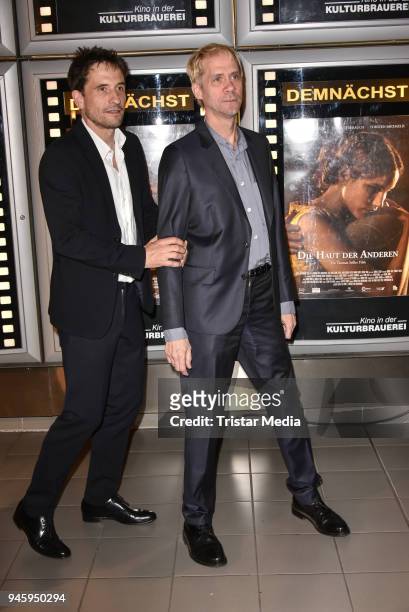 Oliver Mommsen and director Thomas Stiller during the premiere 'Die Haut der Anderen' at Kino in der Kulturbrauerei on April 13, 2018 in Berlin,...