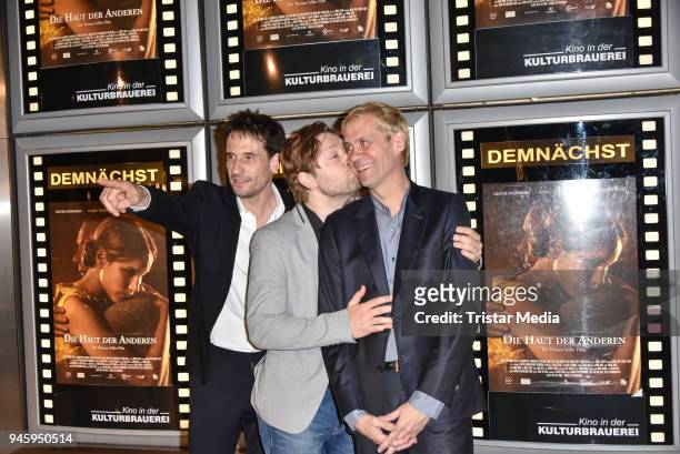 Oliver Mommsen, producer Adrian Topol and director Thomas Stiller during the premiere 'Die Haut der Anderen' at Kino in der Kulturbrauerei on April...