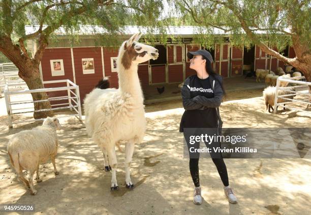 The Walking Dead"'s Christian Serratos visits rescued farm animals at The Gentle Barn Sanctuary on April 13, 2018 in Santa Clarita, California.