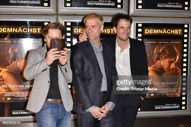 Producer Adrian Topol, director Thomas Stiller and Oliver Mommsen during the premiere 'Die Haut der Anderen' at Kino in der Kulturbrauerei on April...