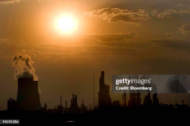 Cooling towers emit steam at the Sasol Secunda plant in the eastern highlands of Mpumalanga province, South Africa, on Sunday, Sept. 9, 2007. Sasol...