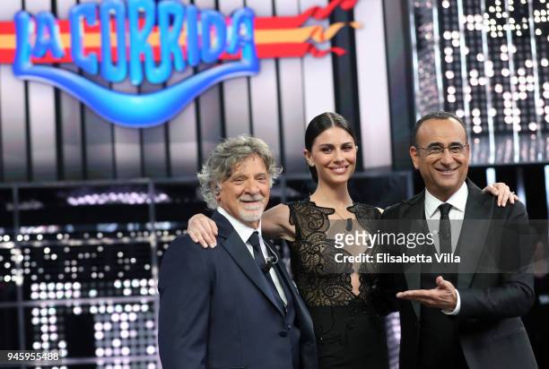 Pinuccio Pirazzoli, Ludovica Caramis and Carlo Conti attend 'La Corrida' tv show on April 13, 2018 in Rome, Italy.