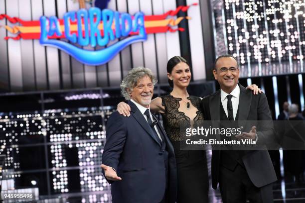 Pinuccio Pirazzoli, Ludovica Caramis and Carlo Conti attend 'La Corrida' tv show on April 13, 2018 in Rome, Italy.