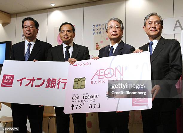 From left to right: Masato Nakamura, vice president of Aeon Bank Ltd., Motoya Okada, president and chief executive officer of Aeon Co., Shoji...