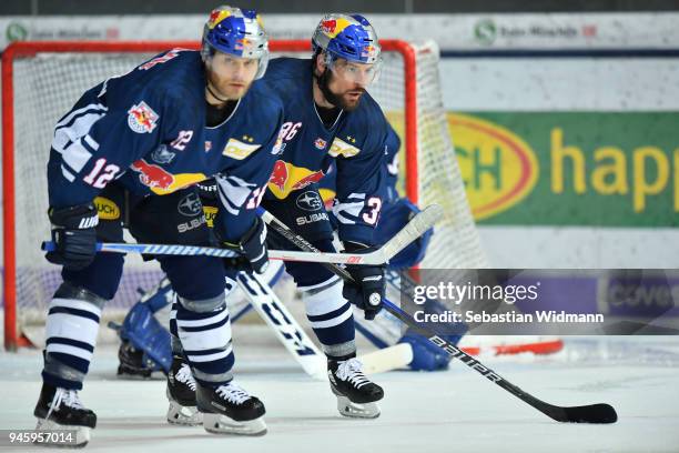 Mads Christensen and Yannic Seidenberg of EHC Muenchen look on during the DEL Playoff Final Game 1 between EHC Red Bull Muenchen and Eisbaeren Berlin...