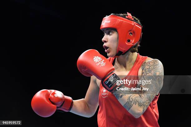 Tamara Thibeault of Canada fights against Lauren Price of Wales the Women's Middle 69-75kg Semifinal bout during Boxing on day nine of the Gold Coast...