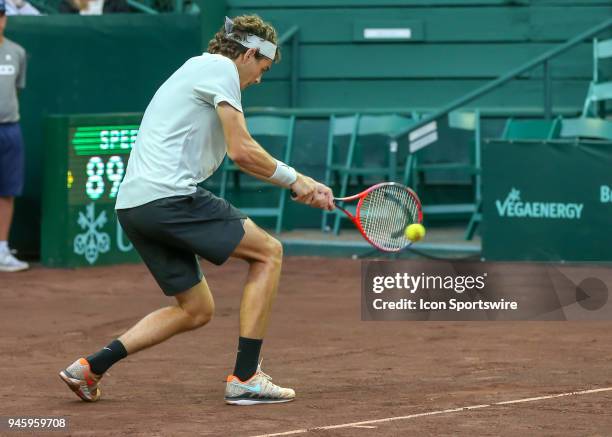 Taylor Fritz of the United States hits the return in the match against Jack Sock of the United States during the Quarterfinal round of the Men's Clay...