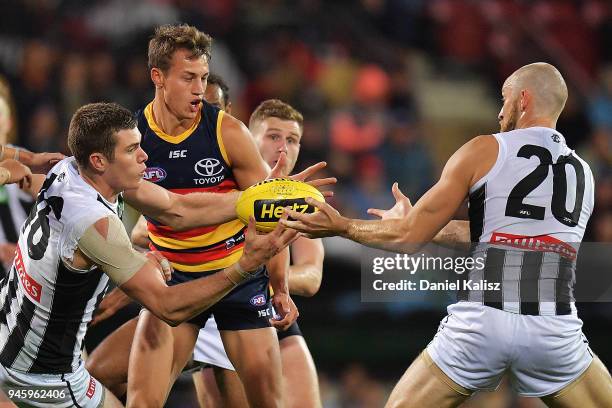 Mason Cox of the Magpies handballs during the round four AFL match between the Adelaide Crows and the Collingwood Magpies at Adelaide Oval on April...