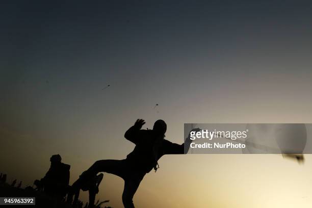 Palestinians protesters during clashes with Israeli topps near the border with Israel in the east of Gaza City on, 13 April 2018. According to local...
