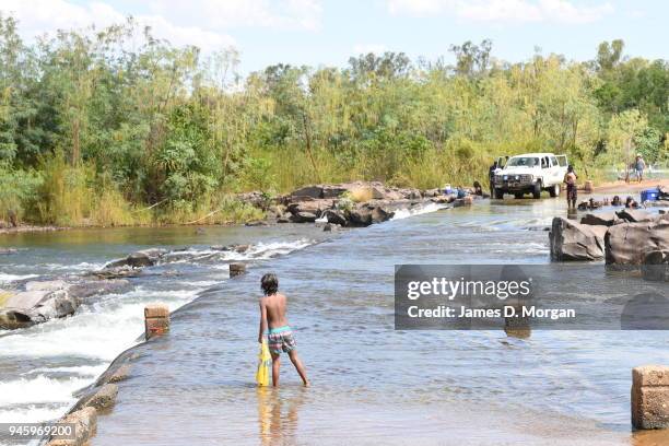 Locals enjoy a Sunday afternoon off jumping into the Lake and fishing in one of the river crossings close to the town on September 25, 2016 in...