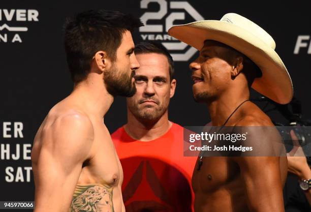 Opponents Carlos Condit and Alex 'Cowboy' Oliveira of Brazil face off during the UFC Fight Night weigh-in at the Gila Rivera Arena on April 13, 2018...