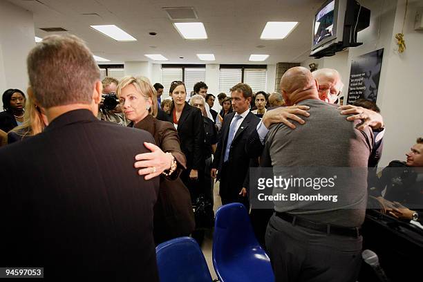 Senator Hillary Clinton from New York, second from left, speaks with Steven Centore, left, a 911 responder, as Representative Christopher Shays from...