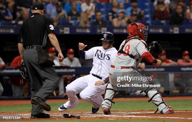 Cron of the Tampa Bay Rays scores a run in front of the tag from Jorge Alfaro of the Philadelphia Phillies in the second inning on a double from...