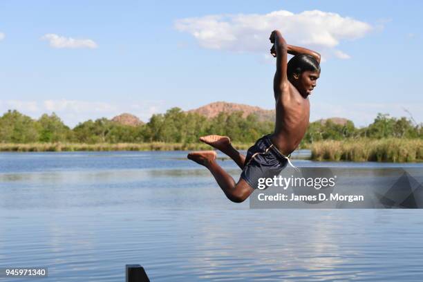 Locals enjoy a Sunday afternoon off jumping into the Lake and fishing in one of the river crossings close to the town on September 25, 2016 in...