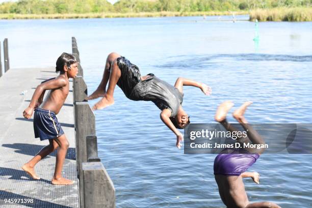 Locals enjoy a Sunday afternoon off jumping into the Lake and fishing in one of the river crossings close to the town on September 25, 2016 in...