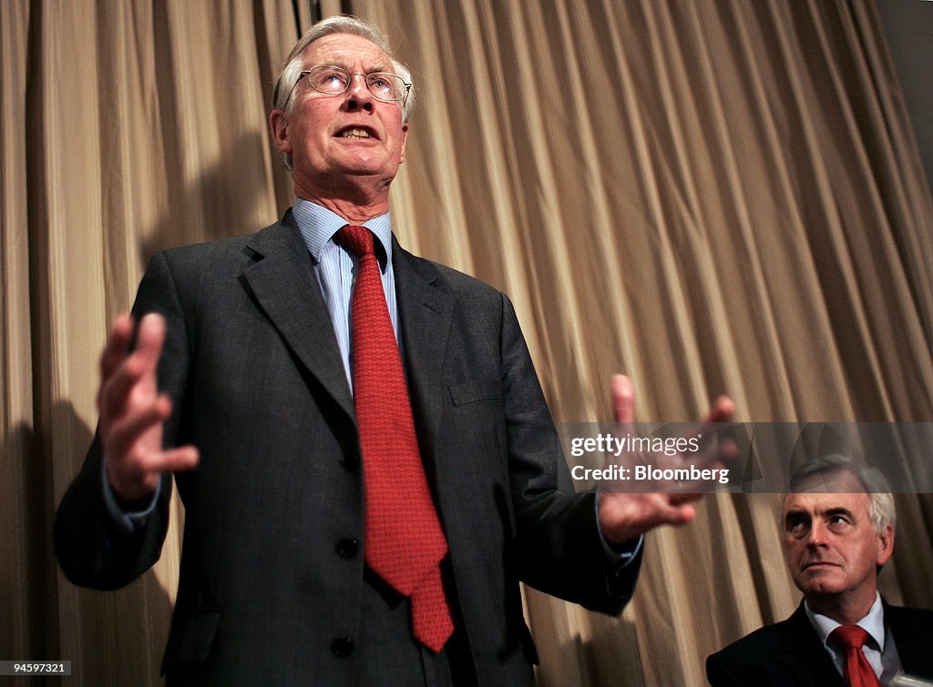 U.K. Labour Party lawmaker Michael Meacher, left, speaks as
