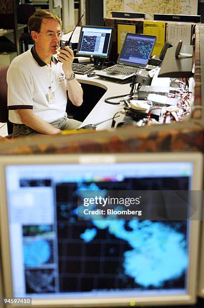 Rick Sagers operates a ham radio at the National Weather Service forecast office in Fort Worth, Texas, Monday, June 26, 2006.